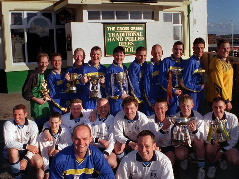The Cross Green Dodgers AFC who were celebrating in June 2001 after winning ten trophies. Pictured at the front are captain's Andy Hawkhead, left, and Marek Krzyworaczka.