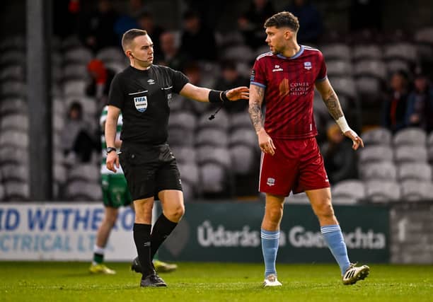 Referee Kevin O'Sullivan checks on Mattie Wolfe, who pulled a goal back for Galway United early in the second-half.