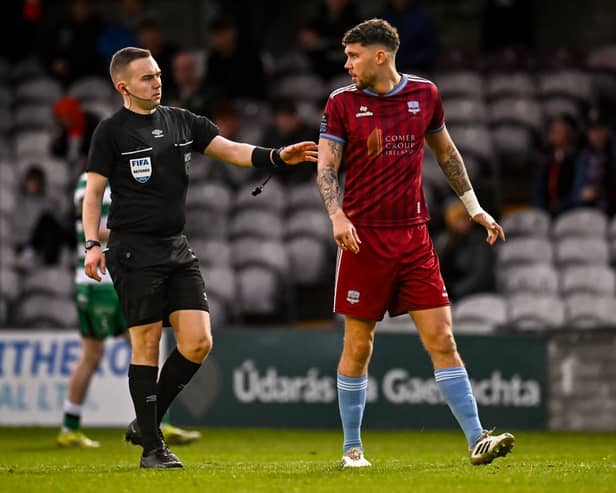 Referee Kevin O'Sullivan checks on Mattie Wolfe, who pulled a goal back for Galway United early in the second-half.