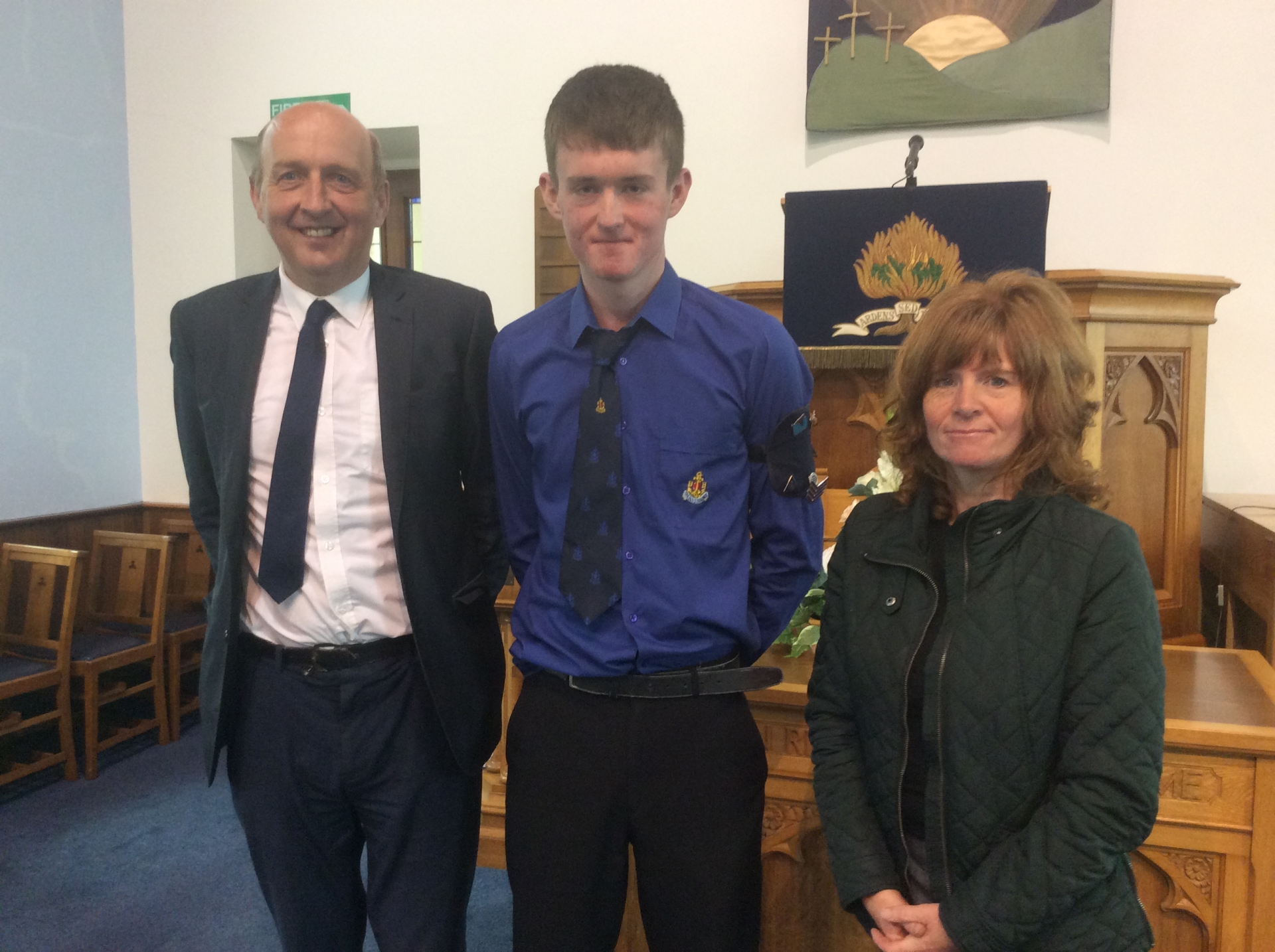 Matthew with his Discharge Certificate and a copy of God’s Word for 13 years service. Matthew is pictured here with his parents Tom and Lorna.