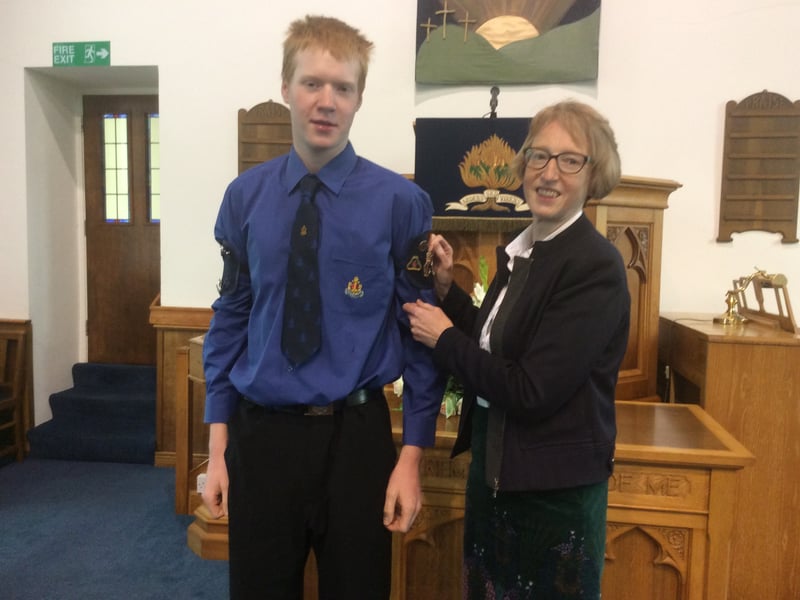 Samuel getting his Queen’s Badge pinned on by his mother Pauline.