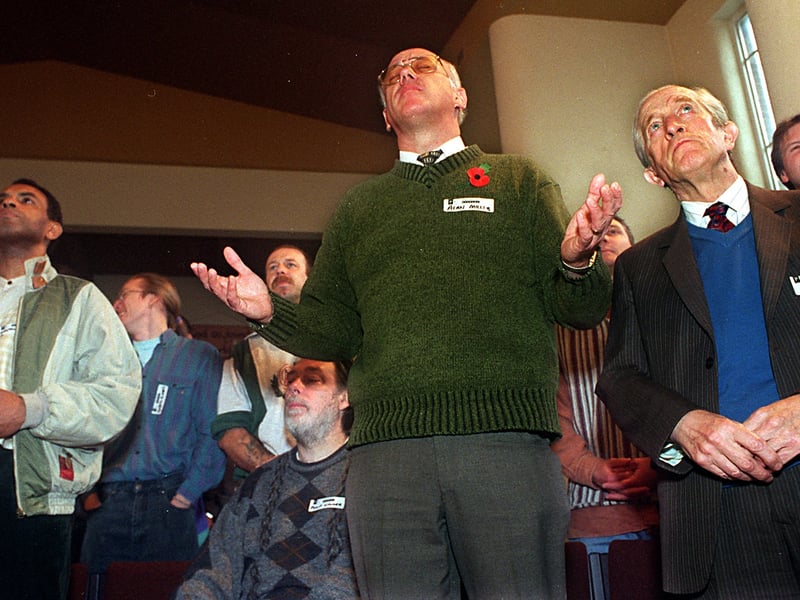 Alan Millis, from Elim Pentecostal Church in York, raises his hands as he joins in the  the hymn singing at Moortown Baptist Church in November 1997.