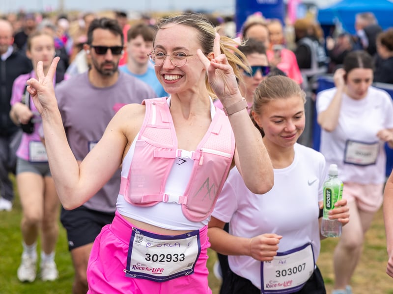 A 10k runner is feeling happy 
