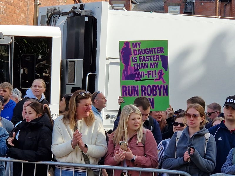 Spectators prepare to cheer on the runners