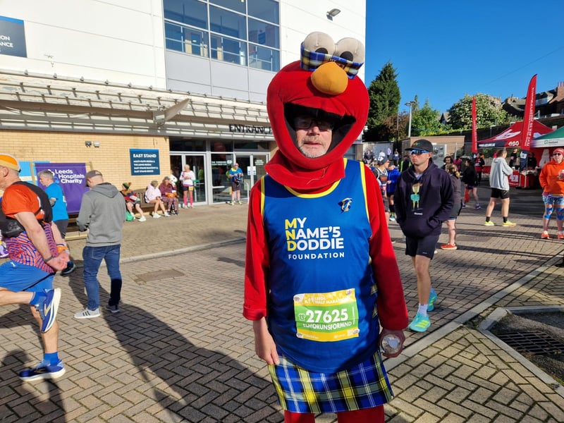 An early contender for best-dressed - this is Dougal Campbell, who is running as Elmo to raise cash for the My Name'5 Doddie Foundation