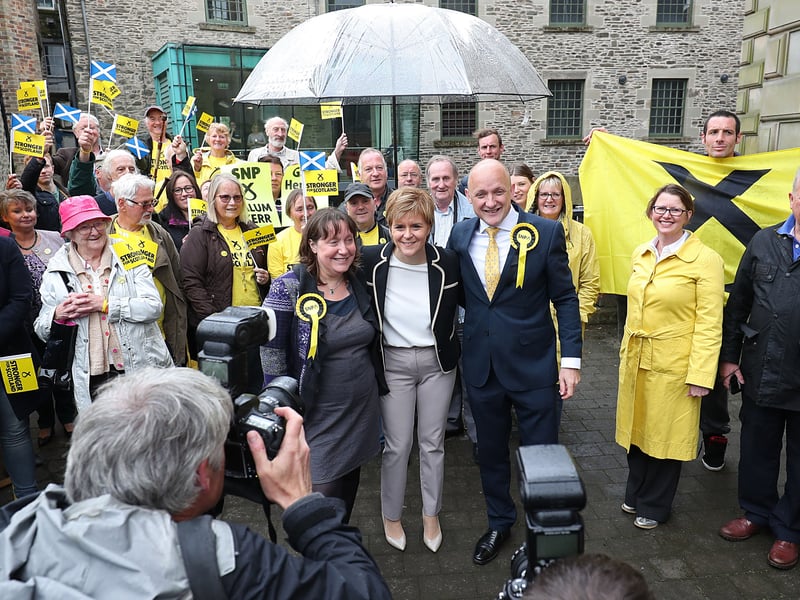 Finally, making the top 10 list of biggest majorities is Calum Kerr (pictured to Nicola Sturgeon's right), who secured the seat of Midlothian South, Tweeddale and Lauderdale for the SNP with a 7,161 majority.
In total he won 14,091 votes, putting him ahead of second place Keith Cockburn from the Scottish Conservatives on 6,930.