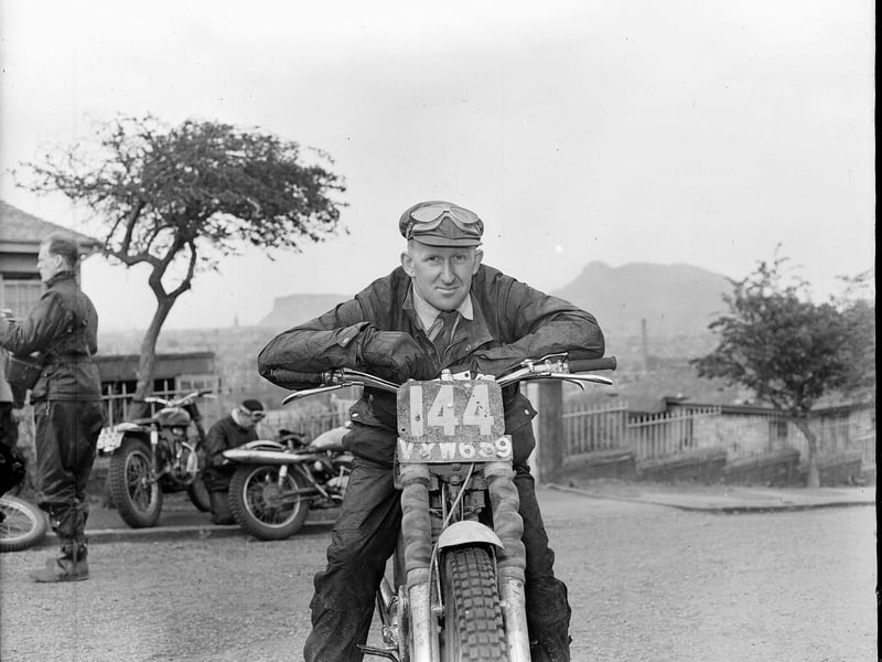 Scottish Six Days Motor Cycle Trial winner GL Jackson relaxing over his handlebars at Blackford Hill in 1956.