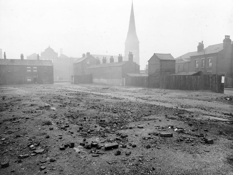 Bell's Buildings with St. Mary's Church in background. Houses and school also in view. Pictured in November 1935.