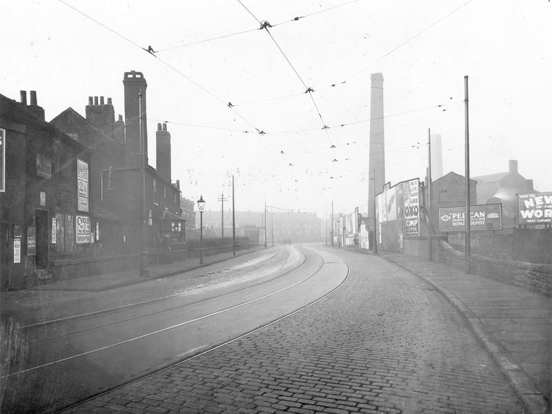 The bridge over Balm Beck, looking towards the junction with New Pepper Road. On the left side nos. 148 and 150 Low Road are the premises of Frederick W. Hardwick, motor engineer. On the right are Lowgate Mills and Hunslet Paper Mills. Pictured in November 1934.
