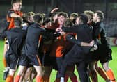 The Bearna Na Forbacha squad celebrate at the end of the penalty shoot-out.