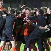 The Bearna Na Forbacha squad celebrate at the end of the penalty shoot-out.