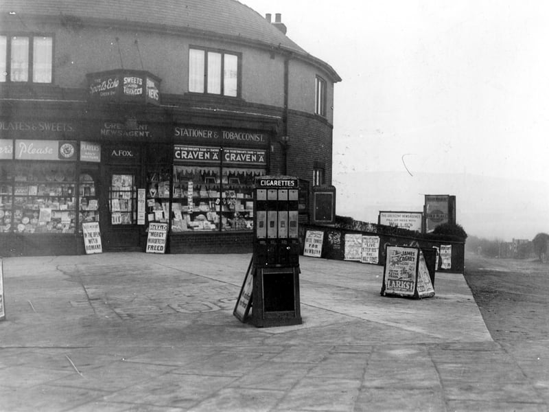 A newsagent on corner of Garnet Road and Dewsbury Road. One the right is the entrance to Hunslet Cricket and Football Club. Pictured in December 1938.