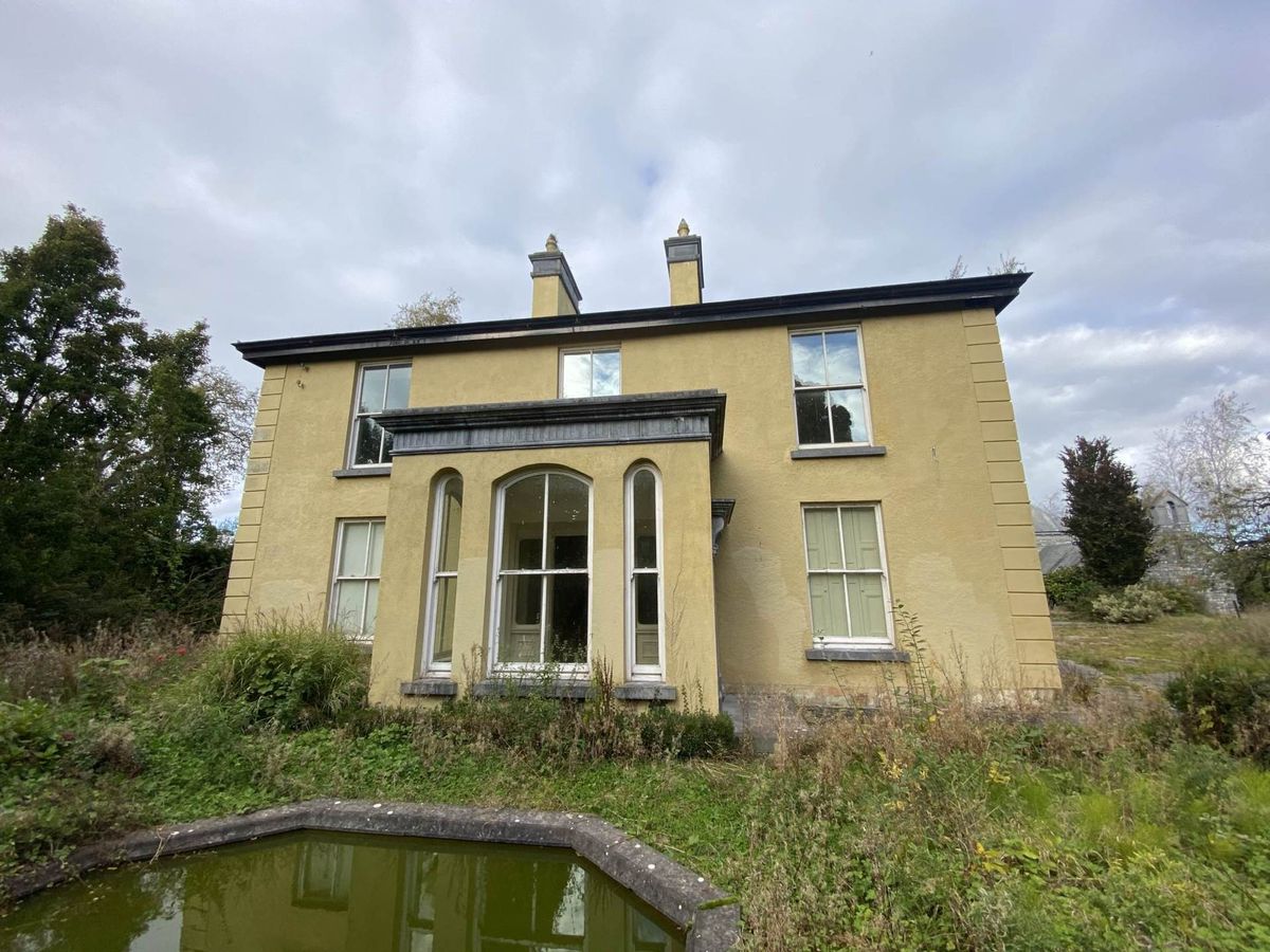 A PERIOD residence and 36 acres in Boher that was sold in September 2024 on the instructions of the Examiner of the High Court is for sale again. Bohergar House has been brought to the market by GVM’s Tom Crosse with a guide of €900,000. The new owners will write their own chapter in the property’s storied history. It was originally owned by the Wilkinson family in the early to mid 19th century. They were related to the famous James Napper Tandy, an Irish revolutionary and a founder of the United Irishmen. Bohergar was purchased by James Humphrys in 1856 for £900 from George Wilkinson. It stayed in the Humphry family for over a century.  Built in the 1930s to replace the original Bohergar House, it is an imposing period house, full of character and boasting many period features including granite sills and door surrounds, elaborate wrought iron balustrade, wooden panelling, coving and cornicing, antique marble fire surrounds and stained glass rooflights to name but a few. The property has since been sold out of Humphry family and they were not the owners when it was put up for auction on the instructions of the Examiner of the High Court last year. It was bought at the time but the purchasers have now  decided to put it back on the market. Mr Crosse, property director at GVM Auctioneers, said it is a lovely period home that has been left go and neglected over a number of years unfortunately and the condition reflects that.  “It does need some love and care. An empathetic buyer with a passion for older houses could restore it to its former glory. It would be a wonderful project in a very classy and affluent location,” said Mr Crosse. Even though it is new to the market, he says there is good interest already. “There is interest locally and I have had a couple of calls from overseas - from America,” said Mr Crosse. Another selling point is the 36 acres of rolling parkland. Coincidentally, Mr Crosse has a further 14.5 acres for sale, adjoining the land, for a different vendor. “It would be