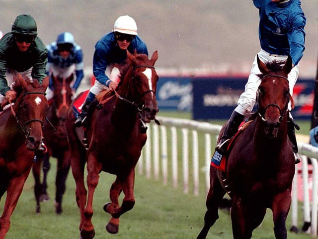 Jockey Richard Hills punches the air after riding to victory on Mutafaweq in the 1999 St Leger Stakes at Doncaster.