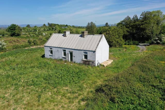 Lavender Cottage in Leitrim, Corriga has gone up for the astonishingly low price of €50,000. The property is partially renovated, with a new corrugated roof, a water connection and a septic tank on site. A savvy buyer will see that there is much to be desired in the condition of the house’s walls. Auctioneer Joe Brady said this cottage is a prime candidate for the Vacant Property Refurbishment Scheme and that “there are things that aren’t visually apparent” done to the property which add value to the listing. “Put another €100,000 into the house, and you’ll have a lovely home for €150,000”, said the seller. Read More: Leitrim Eurovision winner weighs in on RTÉ boycott of competition if Israel competes Brady estimates that the house was built in the 1950s, and said that there has been a large interest in the property since it has gone on the market. He estimates that the property could sell for up to €60,000. The large 1.5 acre site is located in a “rural and tranquil setting”, close to the Cavan border and Carrick-on-Shannon. The house is a two kilometre walk from the village of Aughavas, which is home to a local pub, church, sports ground and national school. The listing on Daft.ie reads: “The elevated site gives excellent views of Sliabh an Iarainn and the surrounding countryside." “Accommodation in brief comprises entrance hallway, living area, three potential bedrooms and potential for bathroom.” REA Brady auctioneers considers the run-down house to be a “gem”.