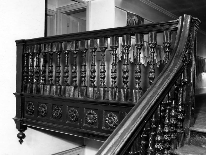 The upper section of an intricately carved wooden bannister in Seacroft Grange. Pictured in October 1949.