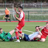Salthill Devon's goalkeeper Arek Mamala and Paul Scally, and Colga's Inacio Lopes Jorge and Ben Lalor, in action in the FAI Junior Cup clash between the sides in Kilcornan back in March.