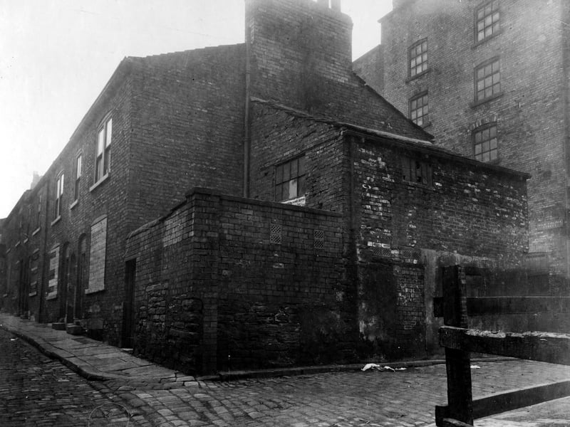 Nelson Street was slocated next to Union Street. It was demolished to create Eastgate. This view shows property before demolition. On the right is a warehouse which was on Back Virginia Street. Pictured in November 1927.