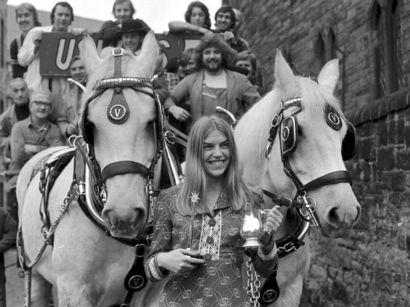 Scottish athlete Helen Golden receives the Usher-Vaux Sportswoman of the Year Award for 1973 beside a brewer's dray outside the brewery in October 1974
