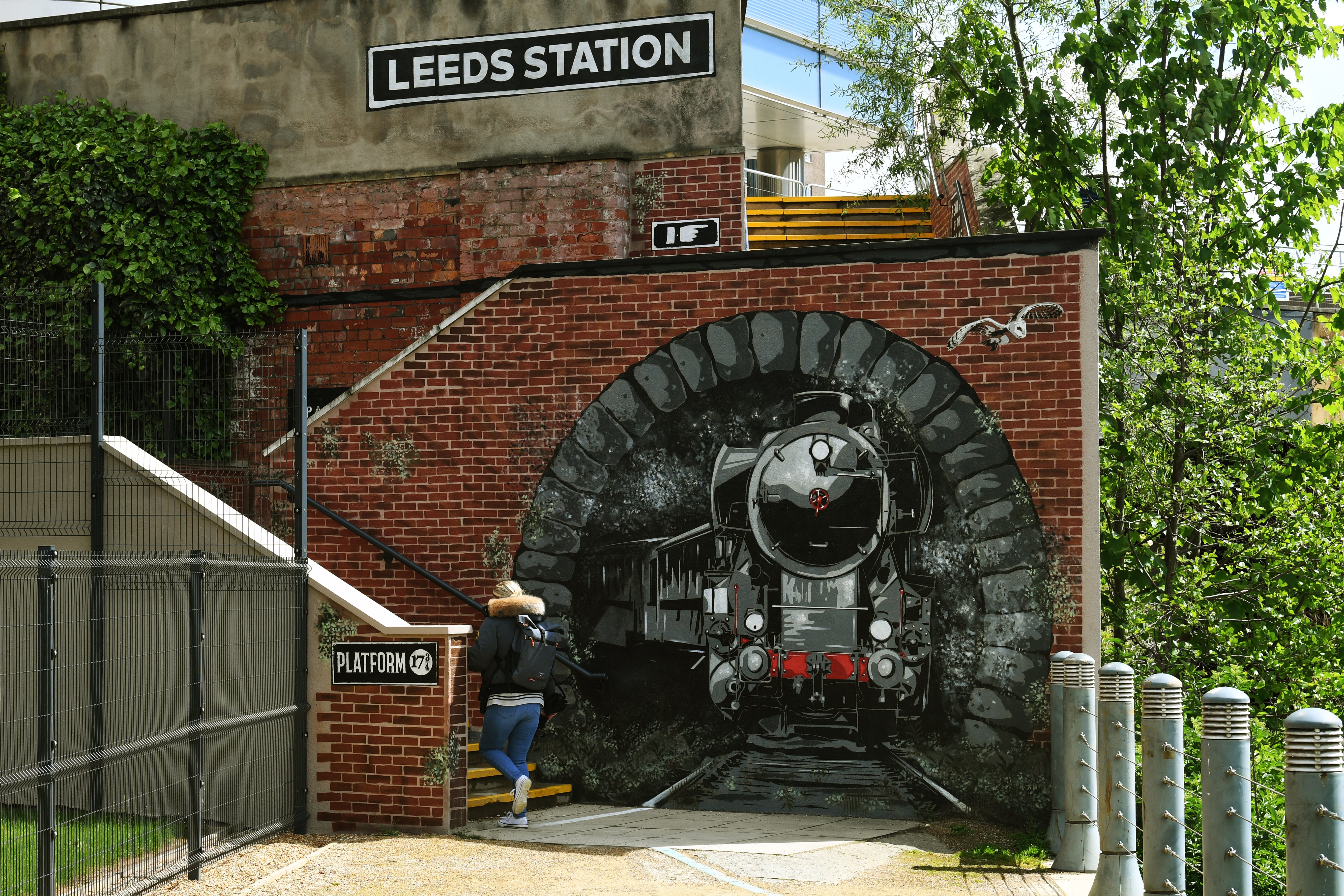 The Harry-Potter themed mural shows a train travelling through a tunnel close to the station