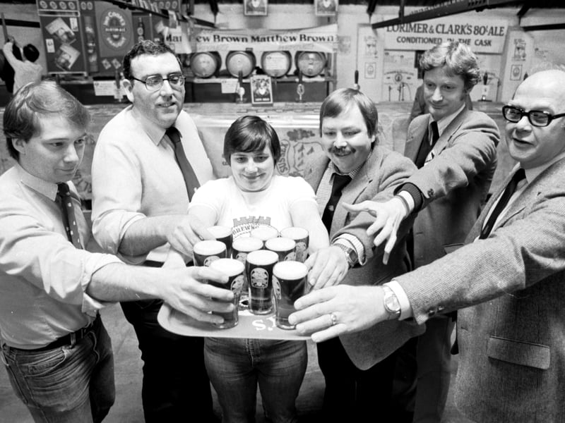 Beer drinkers help themselves to a pint at the CAMRA (Campaign for Real Ale) festival at Caledonian Brewery, Edinburgh, in May 1985