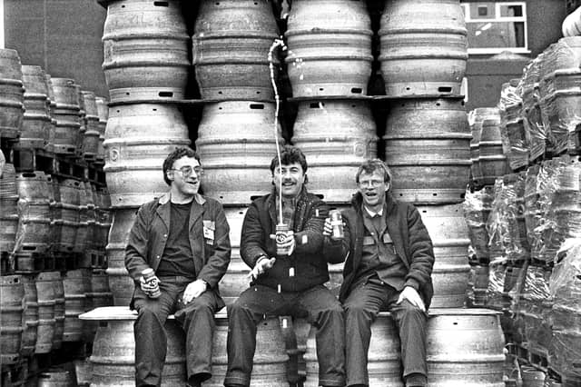 Fountain Brewery workers Harry Traunter, John Smith and Tom Owens celebrate in March 1989 after a planned merger by the Australian company Elders IXL with Scottish & Newcastle Breweries fails