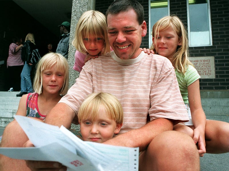 Leslie Warren with his children after he gained 3 B's and 2 C's at GCSE level. Leslie retired from engineering due to diabetes.