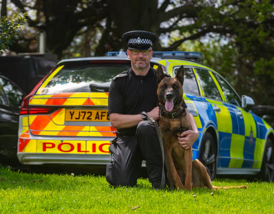 PC Lee Geary from West Yorkshire Dog Section with police dog Mason.