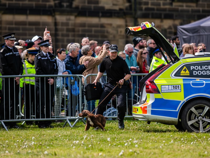 PC Duncan Matthew with a specialist sniffer dog.