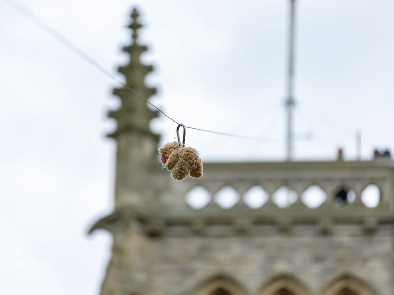 A teddy bear flying down the zip wire at Alverstoke Spring Fair.