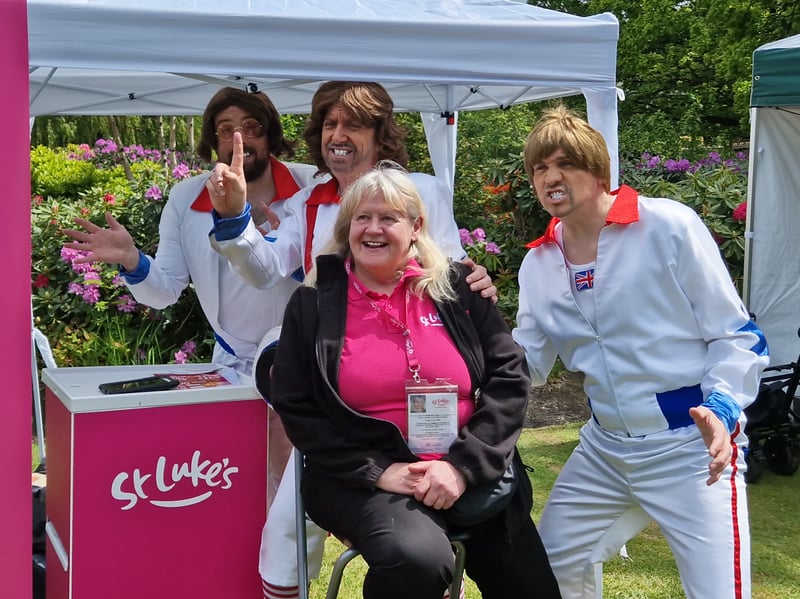 Entertainers Team BGee serenade Deborah Lowe on the St Lukes stall with a Bee Gees song at the May Fayre, in Weston Park. Photo: David Kessen, Iconic Media