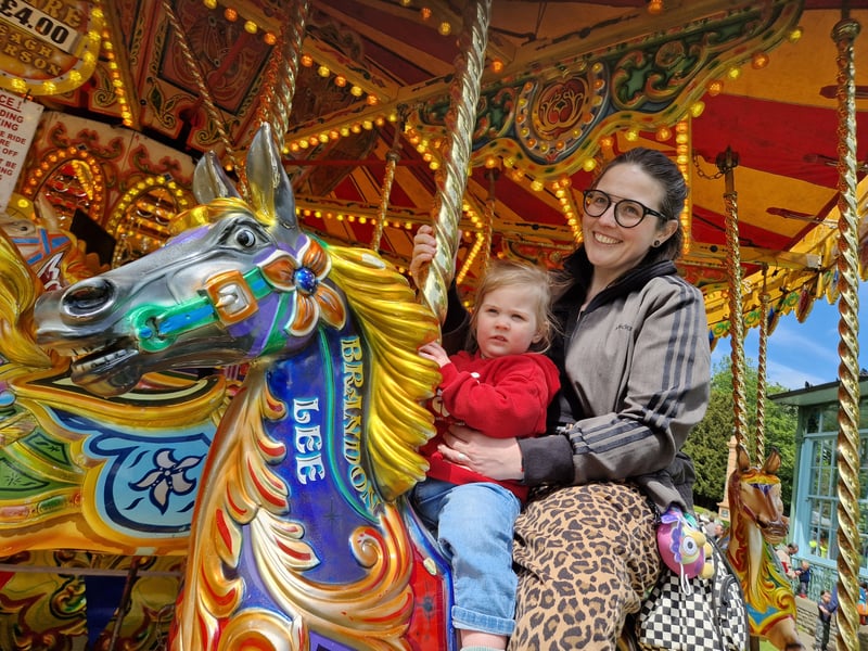 Mum and daughter Rowan and Vic Thorley enjoyed the Carousel at the May Fayre at Weston Park. Photo: David Kessen, Iconic Media