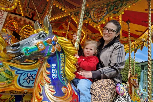 Mum and daughter Rowan and Vic Thorley enjoyed the Carousel at the May Fayre at Weston Park. Photo: David Kessen, Iconic Media