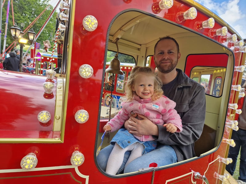 A dad and daughter try out the train ride at the May Fayre, at Weston Park. Photo: David Kessen, Iconic Media.