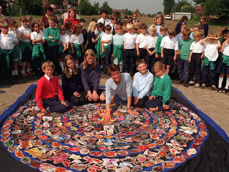 The official opening of the reclaimed area at Gisburn Road leading to the Southern Washlands Nature Reserve and the Calder and Hebble Canal, featuring a mosaic with artistic contributions from local  schoolchildren. in June 1997.  Pictured is artist Jan Harley with children Mark Bradshaw, Anna Ellis, Claire Gamble, Scott Hooley and Lacey Broadbent. 