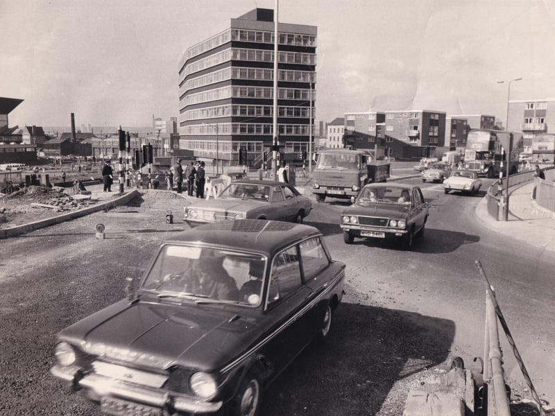 Motorists coming from Burley Road use the new traffic diversion that joins The Headrow at Westgate roundabout in April 1973 In the background is Telephone House. Westgate Baths are on the extreme right.