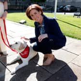 Education Minister Hildegarde Naughton with a school support dog Snow at the launch of AADI Schools Support Programme at Government Buildings, Dublin last week. 