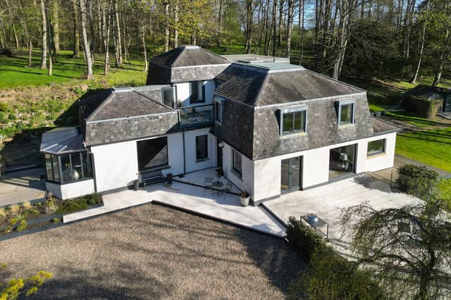 Orchard Wood is set within stunning gardens and grounds of approximately 1.7 acres with sweeping lawns, mature woodland and the Belsis Burn running along the southern border. A private driveway off the shared lane leads to a modern detached double garage with underfloor heating and an extensive gravelled parking area.