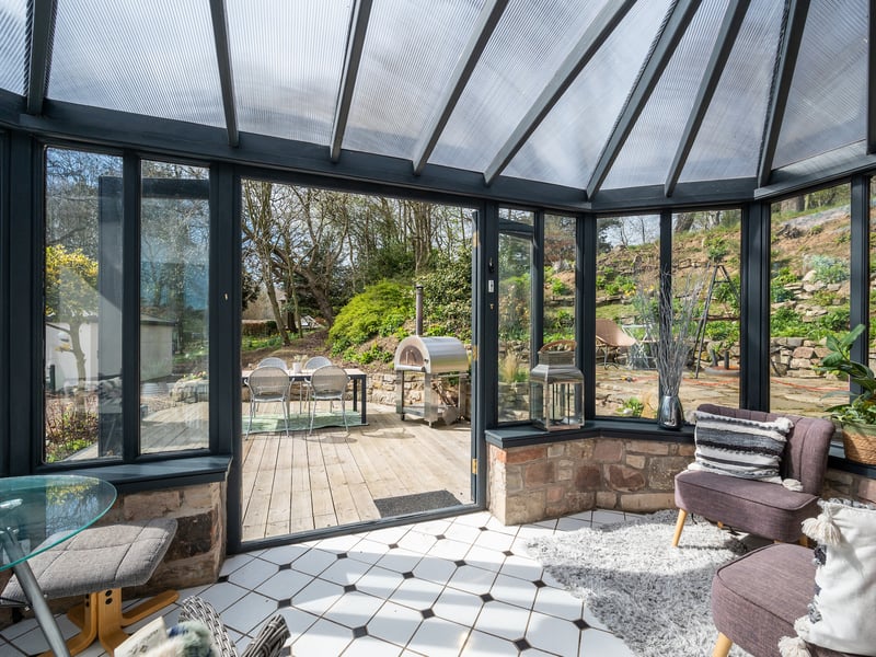 Expansive windows flood the house with natural light and provide lovely open views over the extensive private grounds and the countryside beyond.