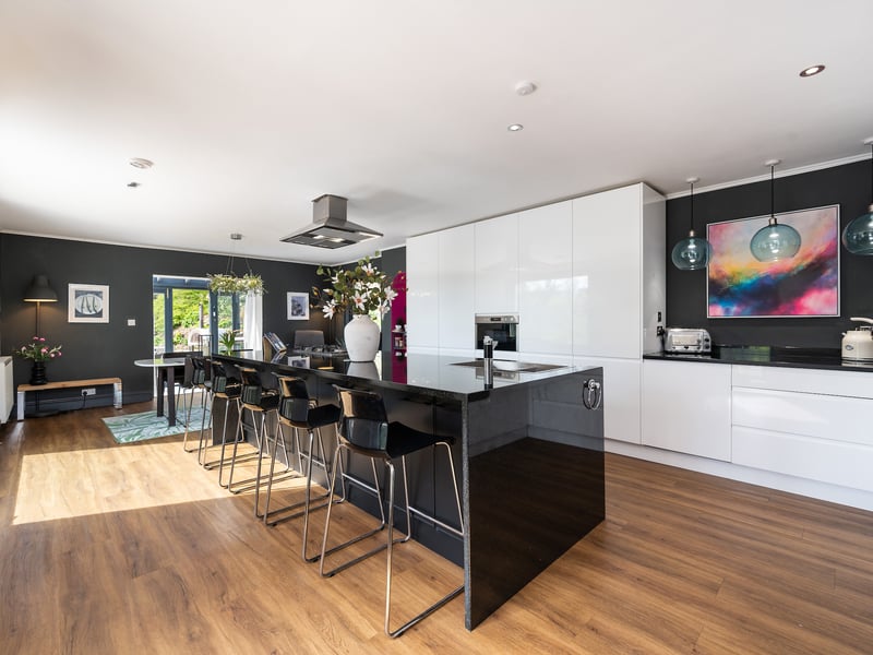 Of particular note is the superb kitchen/dining room with modern units, a central island and double doors to the conservatory.
