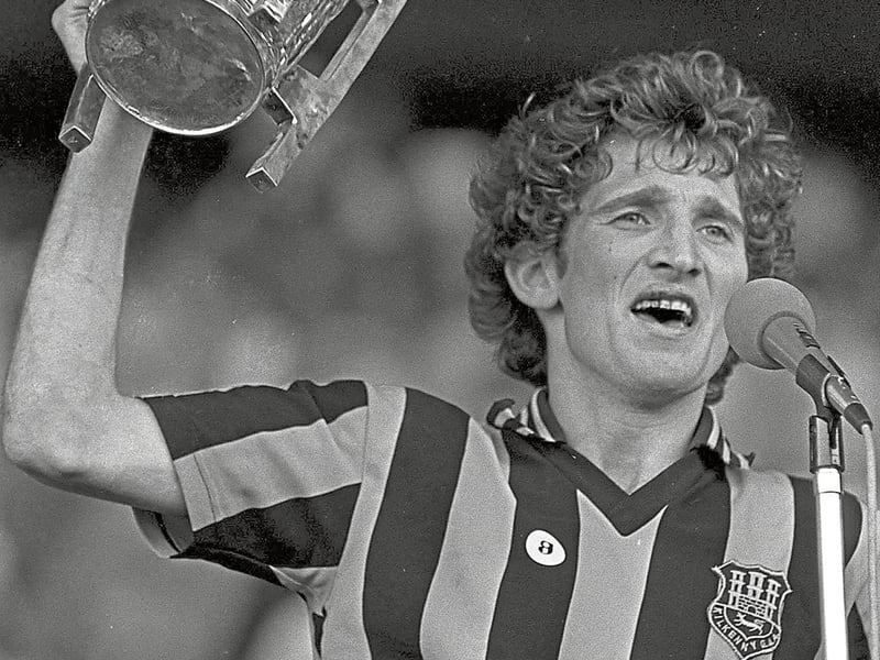 Memories of a golden age of 1980s hurling will be recalled later this year when the Kilkenny double-winning teams of 1982 and 1983 reunite for a special celebration. Hard to believe, but it is 40 years since Kilkenny won back-to-back All-Ireland and National Hurling League titles in 1982 and 1983. Members of both panels will come together again to recall their glory days at a reunion in Langton’s this September. The winning run began in April 1982, when Kilkenny scored a 2-14 to 1-11 victory over Wexford in the National Hurling League final which was played in Croke Park. Ironically, Kilkenny played that year in Division 1B, winning promotion to Division 1A the following year. That result created expectations of championship success and Kilkenny started impressively in the Leinster semi-final, beating Westmeath 7-31 to 0-13. Offaly, who beat Wexford in the Leinster quarter-final that year, were Kilkenny’s opponents in the Leinster final. They were also the reigning All-Ireland and Leinster champions. The closeness of the exchanges and the tightness of the marking meant that the game was always going to be low scoring. Offaly were 0-12 to 0-9 in front with six minutes remaining when a Dick O’Hara delivery towards the Offaly goal appeared to be going wide. The Offaly goalie Damien Martin was shepherding the ball over the line when Liam Fennelly flicked it across the square to Matt Ruth, who finished it to the Offaly net. Martin and Offaly were adamant that the ball had gone wide. TV pictures were inconclusive, but Kilkenny were not complaining. That goal tied the game and Kilkenny summoned up two final big efforts with points from Ger Fennelly and Billy Fitzpatrick to win by 1-11 to 0-12. In the All-Ireland semi-final Kilkenny overcame Galway on a score of 2-20 to 2-10 to qualify for the All-Ireland final. Cork were Kilkenny’s opponents in that final which was played in Croke Park on September 5. The Rebels comprehensively beat Waterford by 5-31 to 3-6 in the Munster final and were warm favourites