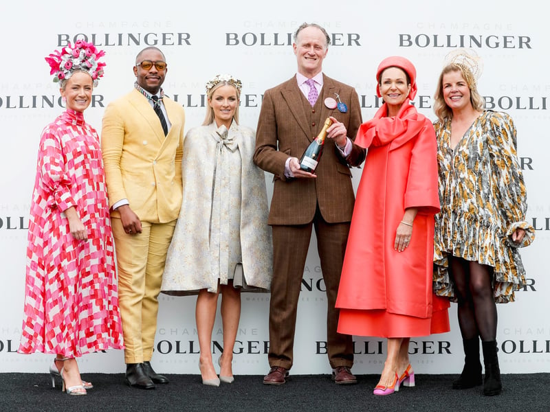 Michael Walsh from Monkstown who won Best Dressed on the first day of Punchestown pictured with the Style Council - Sarah Battle, Lawson Mpane, Suzie O'Neill, Jess Colivet and Marietta Doran.
