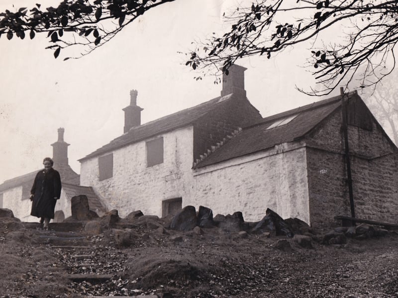 Mary Dewhirst, secretary of Ilkley Civic Society, walks alongside White Wells in October 1969. 