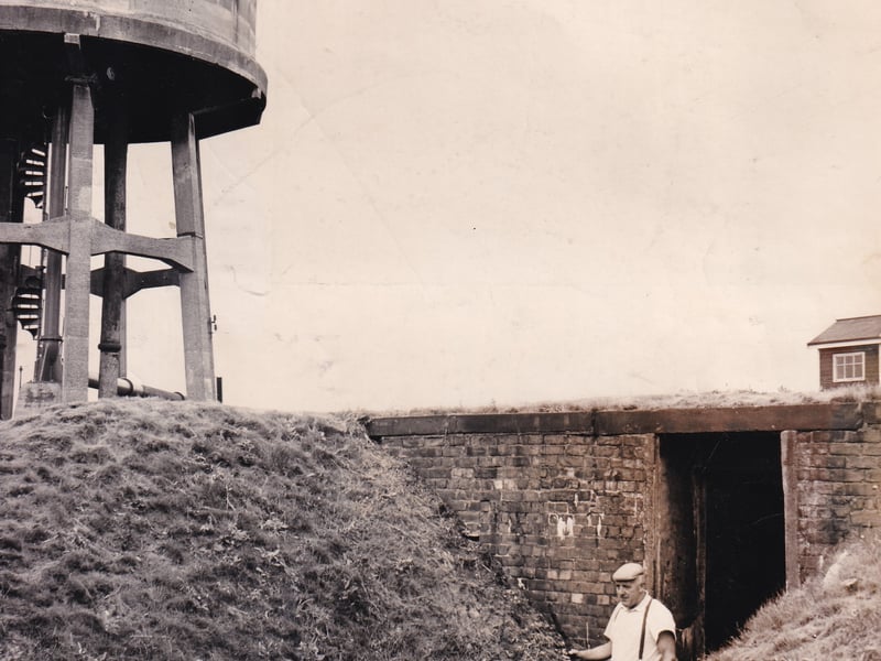 The old air raid shelter near the water tower in August 1970. Pictured at the entrance to the shelter is Arthur Sellars, a Leeds Corporation waterworks employee.