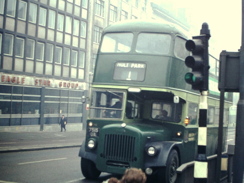 The no. 1 bus on route to Holt Park, outside Eagle Star Group building on The Headrow, close to the junction with Cookridge Street. The bus is Daimler-Roe bodied. Pictured in October 1974.