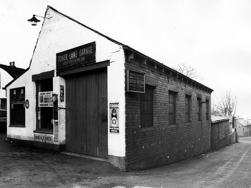 Part of the premises of the Tower Lane Garage pictured in November 1963. The garage was owned by the Britton's and offered repairs and spare parts sales and also had petrol pumps (not in view). On the right is a private road leading to Tower Works, the premises of the Leeds Meter Co Ltd.