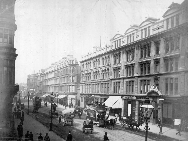 Horse-drawn trams and hackney cabs on a Belfast Street in 1875