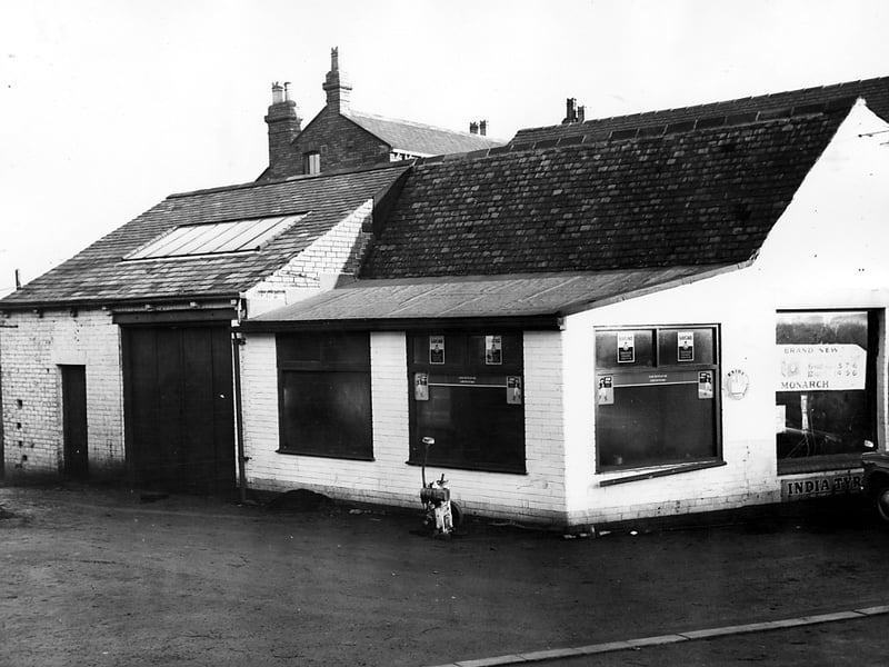 Tower Lane Garage in November 1963. The photo shows one of two buildings which made up the garage. This building dealt with spare parts. In the window, a poster advertises Brand New Monarch car batteries, 6 volt from £3.7s6d or 12 volt from £4.19s6d.