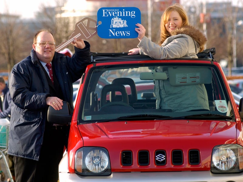 Evening News competition winner Kelly Pringle from Stenhouse with her new Suzuki Jimny Jeep. She is pictured in January, 2005 with Robert MacGregor from Belmont Suzuki Sighthill.