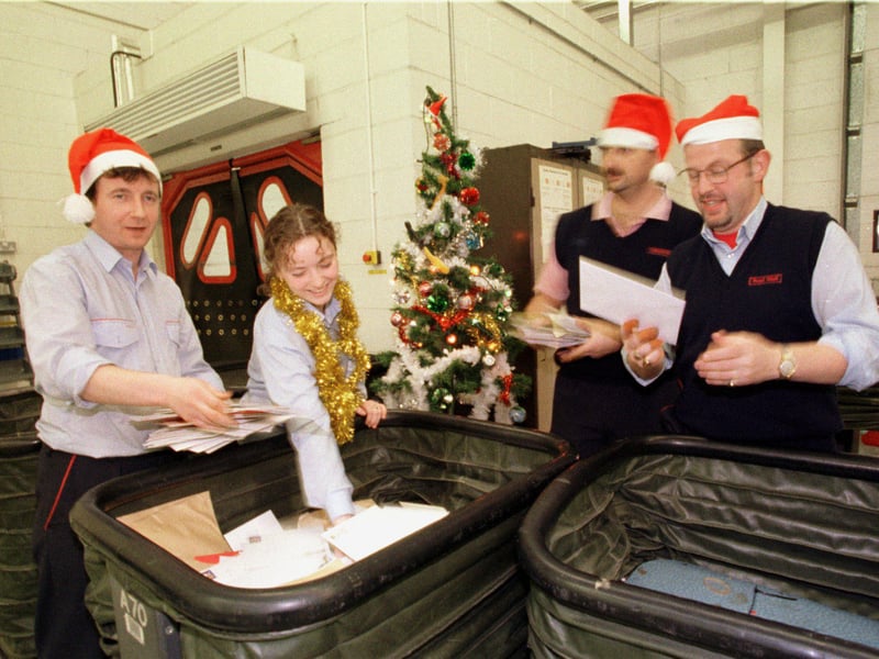 Postal workers David Harris (left), Lynette Williamson, Pat Quinn and Alan Fleming got into the Christmas spirit in 1997 at the Sighthill Royal Mail depot.